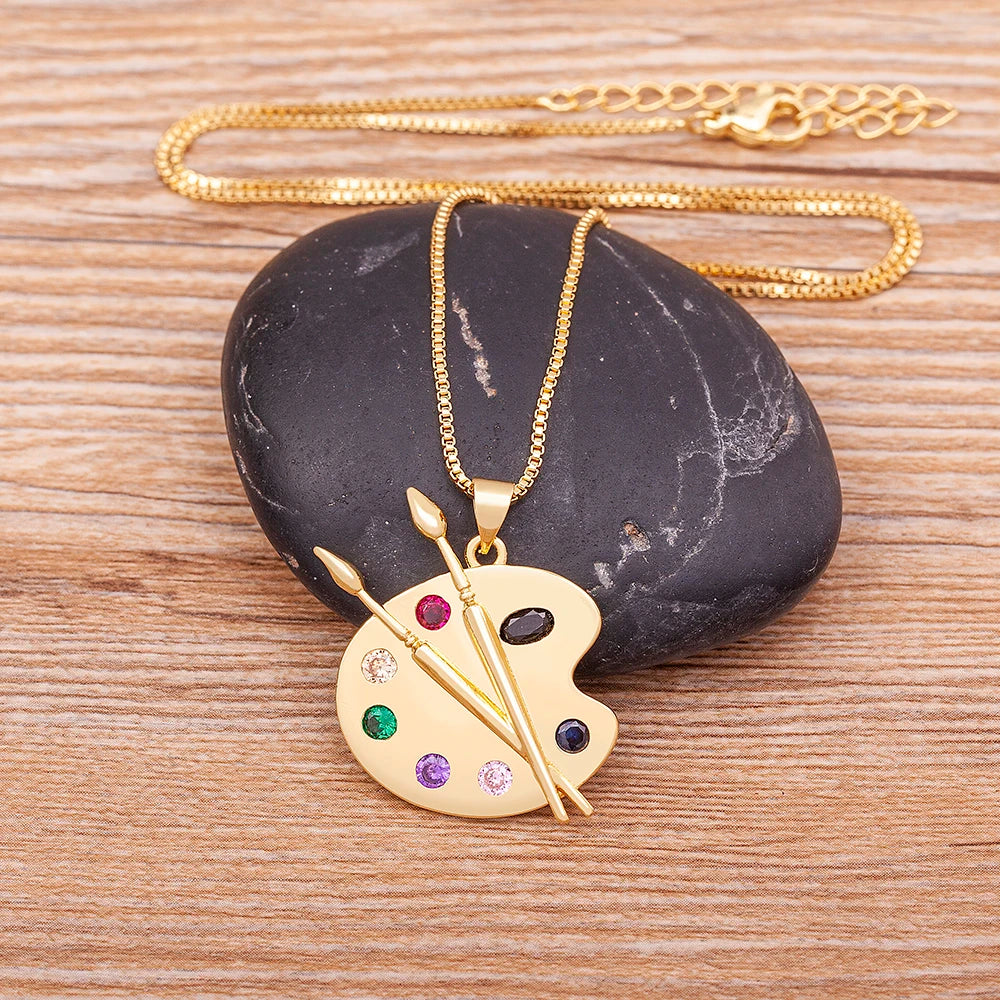 Artist Palette Pendant Necklace – Gold Paintbrush Jewelry with Colorful CZ Crystals